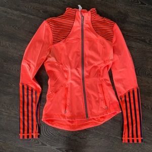 Lululemon jacket in neon orange.  Size 6.